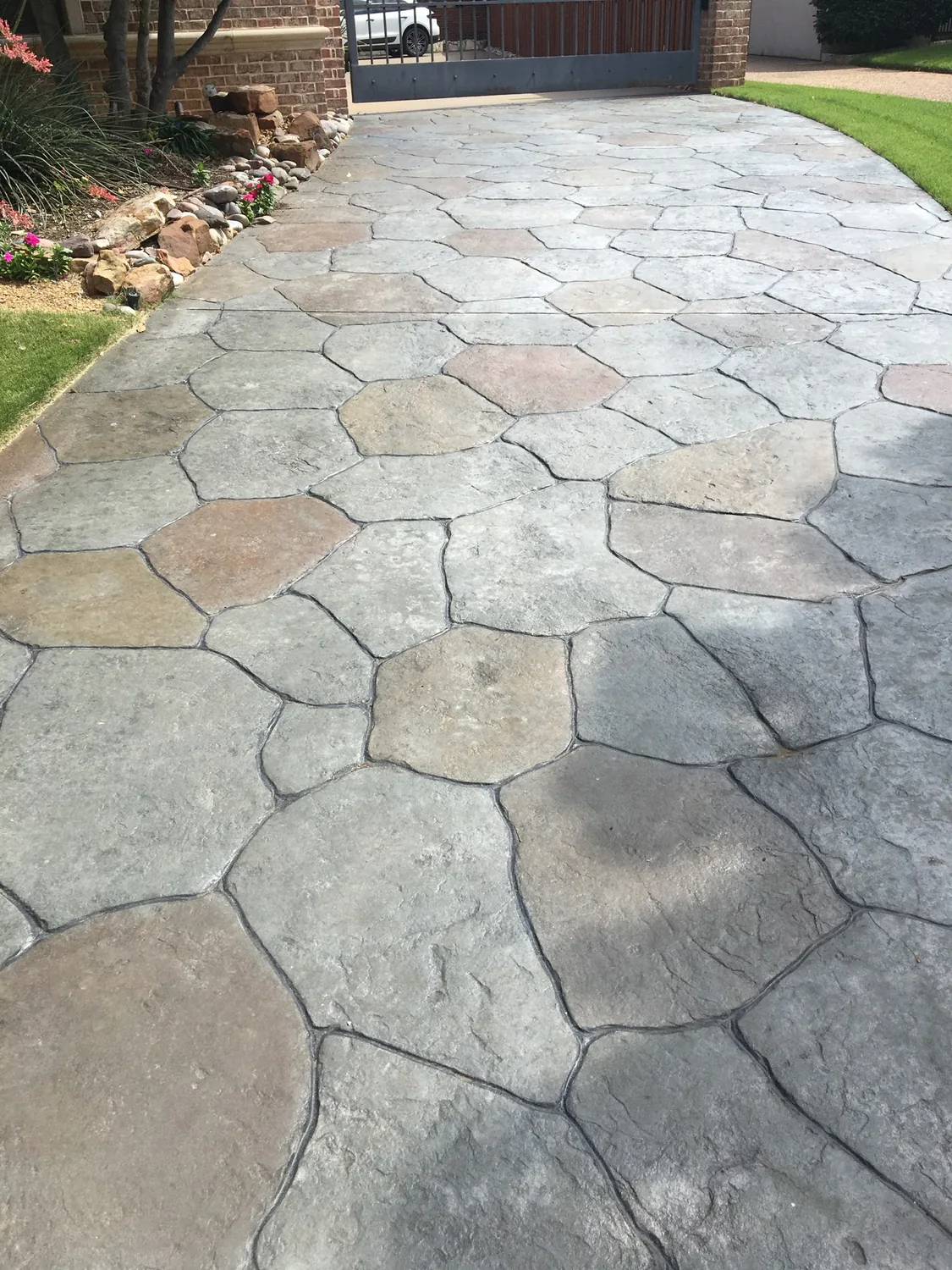 A backyard remade in stamped concrete by Lucky&rsquo;s Concrete in Denton